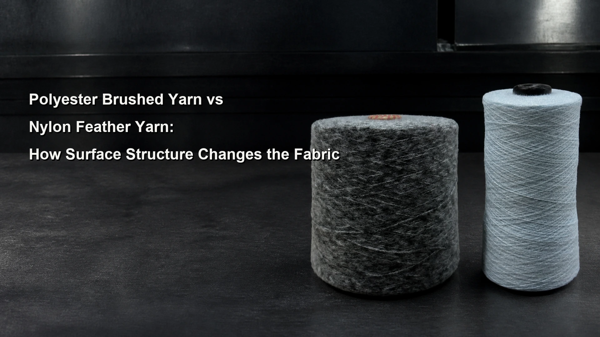Polyester brushed yarn and nylon feather yarn cones on a textile laboratory bench